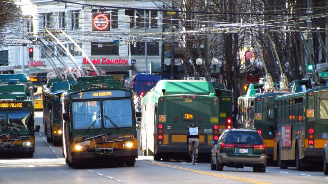 Buses and one car on 3rd