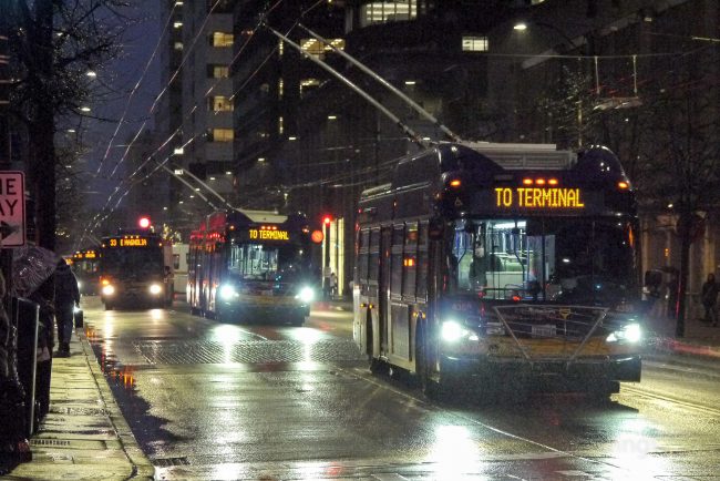Rainy Third Avenue with lots of buses